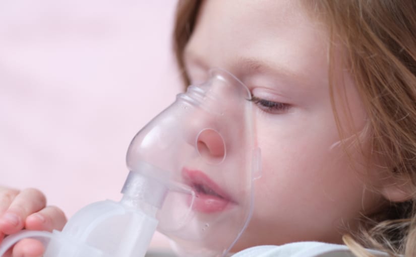 Child using oxygen mask