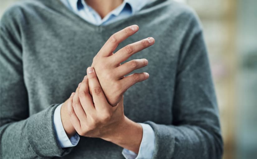 Man holding wrist