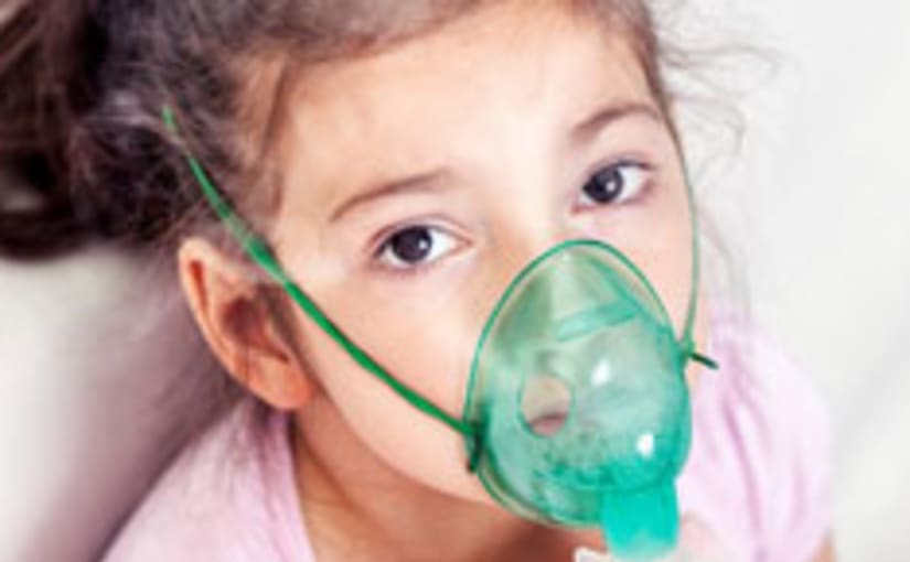 Child wearing oxygen mask